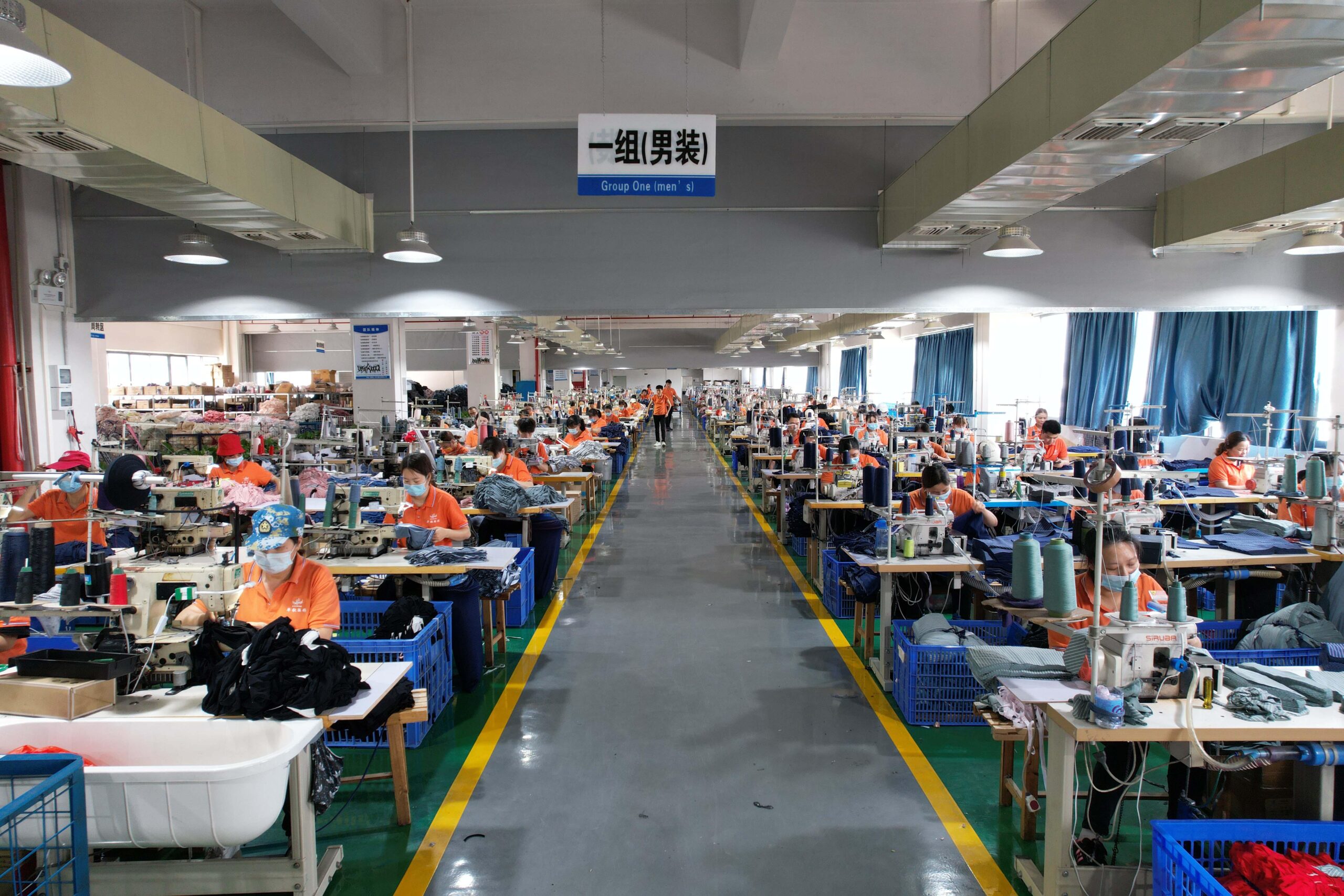 Factory sewing line producing bulk custom underwear orders