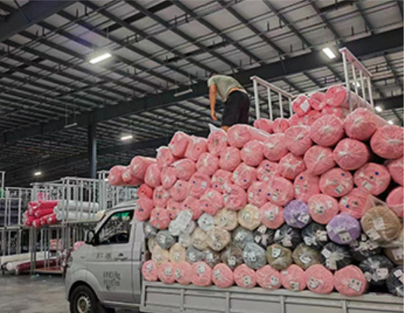 Bulk fabric rolls being sourced and prepared for production